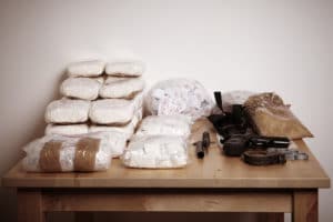 Drug packages, raw opium, drug dozens and weapons seized by police
